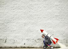 Fun picture of child with rocket booster on their back